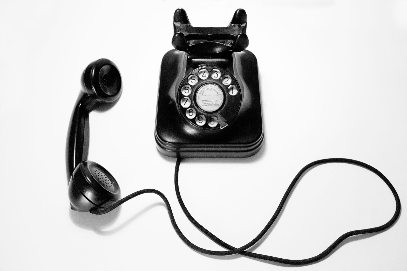 A black rotary phone is off the hook. Champaign County Jail - free phone calls