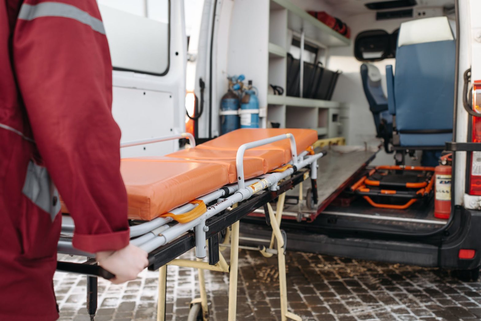 A man is pushing a stretcher. Article - Michael Anderson