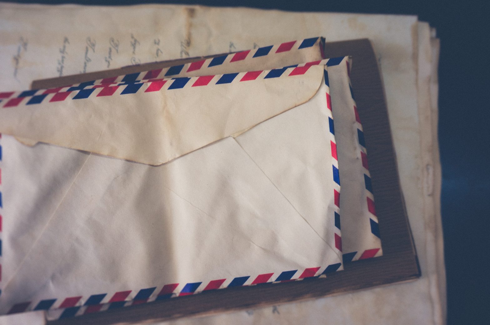 A stack of old mail. News - digital mail system