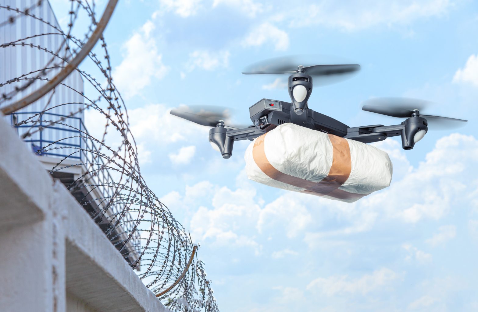 A drone entering a prison wall carrying contraband. Evans Correctional Prison - Jada Young - Dorian Mallory