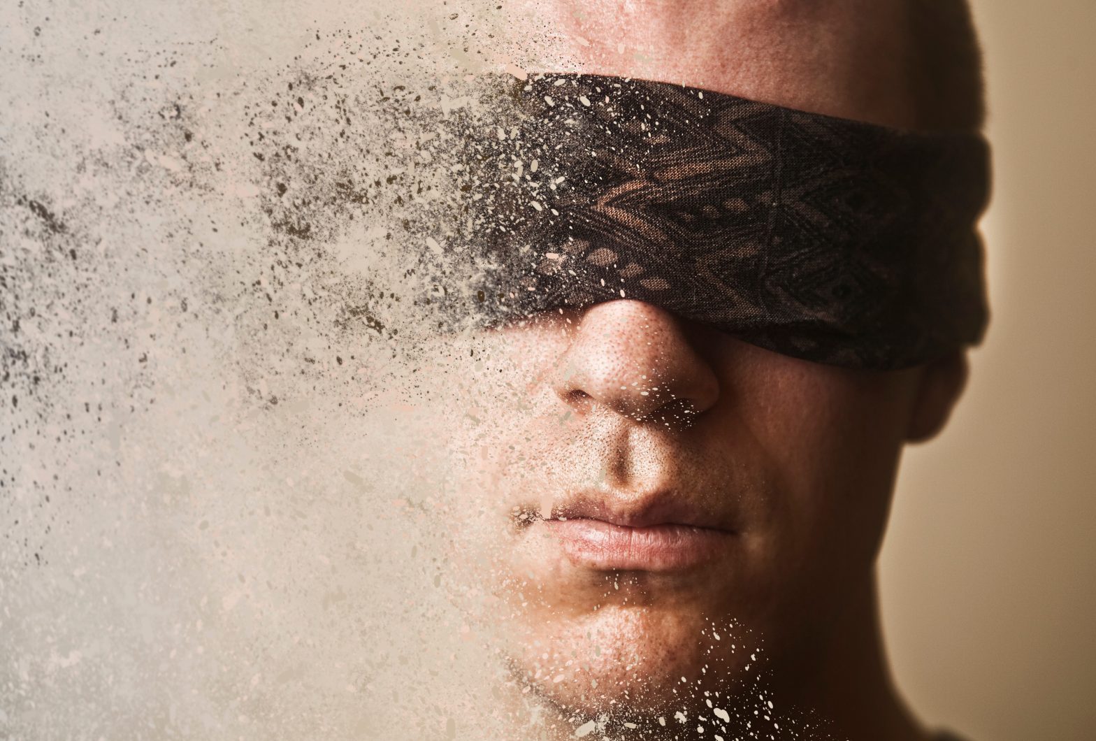 A man with a blindfold over his eyes disintegrates into dust. incarcerated individuals with vision disabilities - Arizona Department of Corrections, Rehabilitation, and Reentr