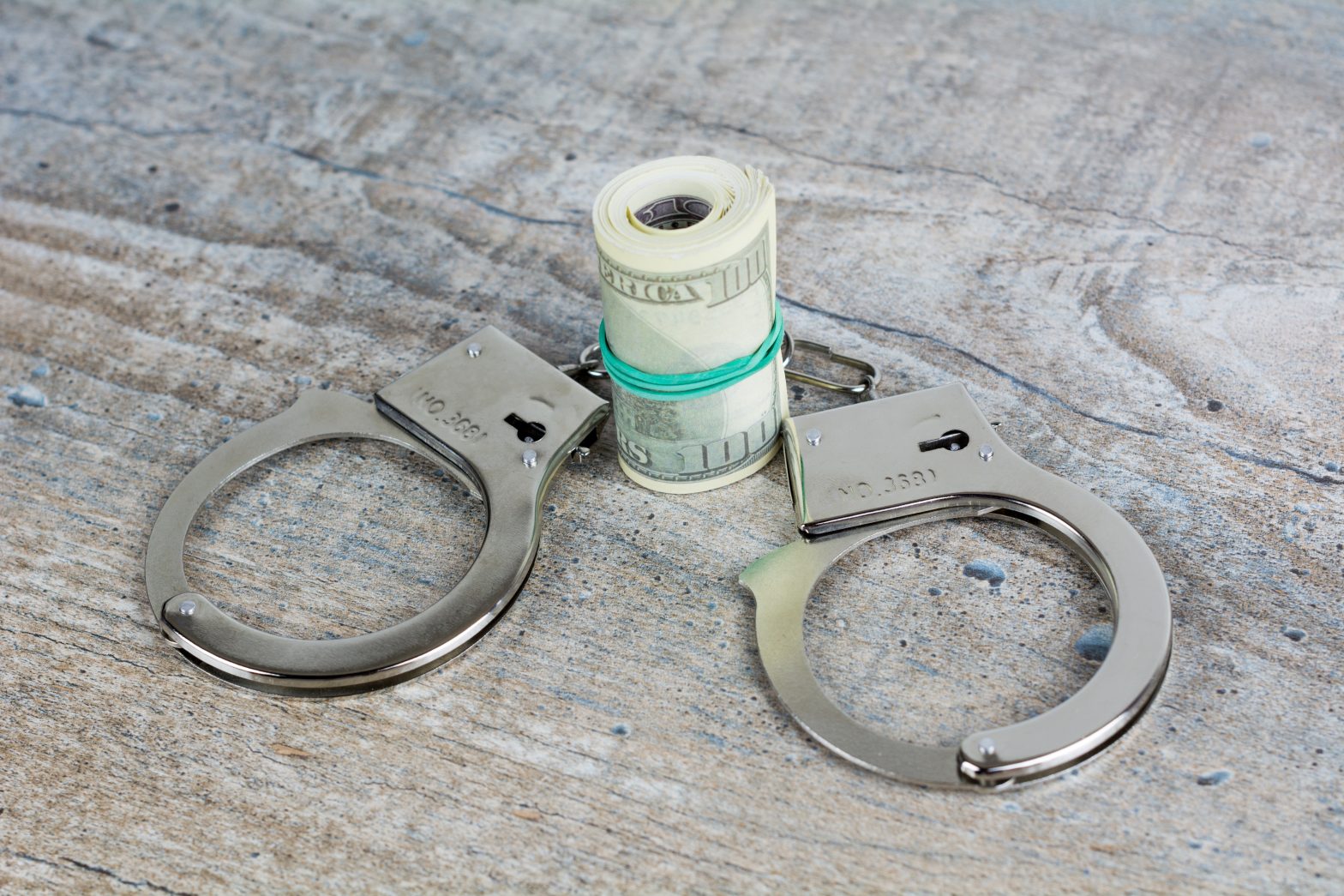 Handcuffs and USA dollar banknotes. Krystle Burrell Rikers Island jail