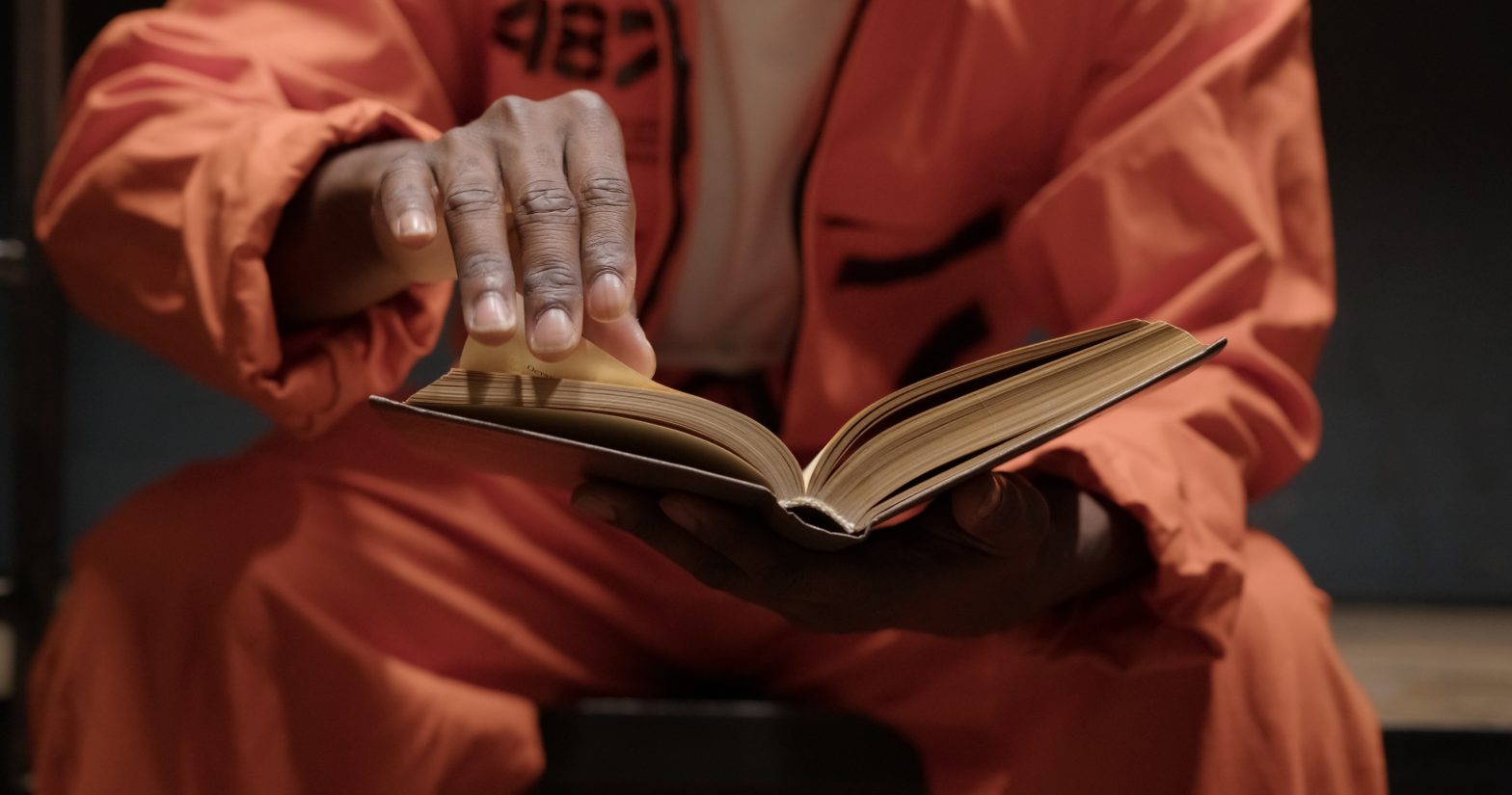 A prisoner reading a book. prison education - Chippewa County Correctional Facilities