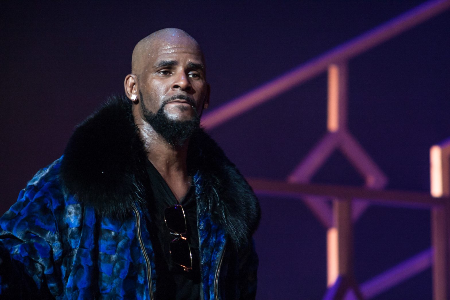 R. Kelly performs on stage.