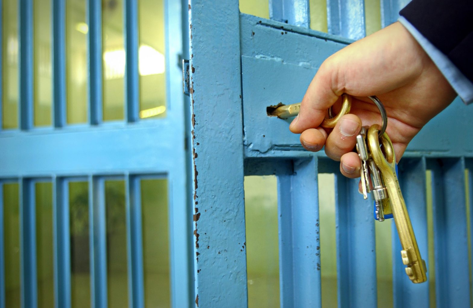 A prison officer locking the prison corridor gate. News - Clayton County Jail tightens security measures after inmate tries daring escape through HVAC system