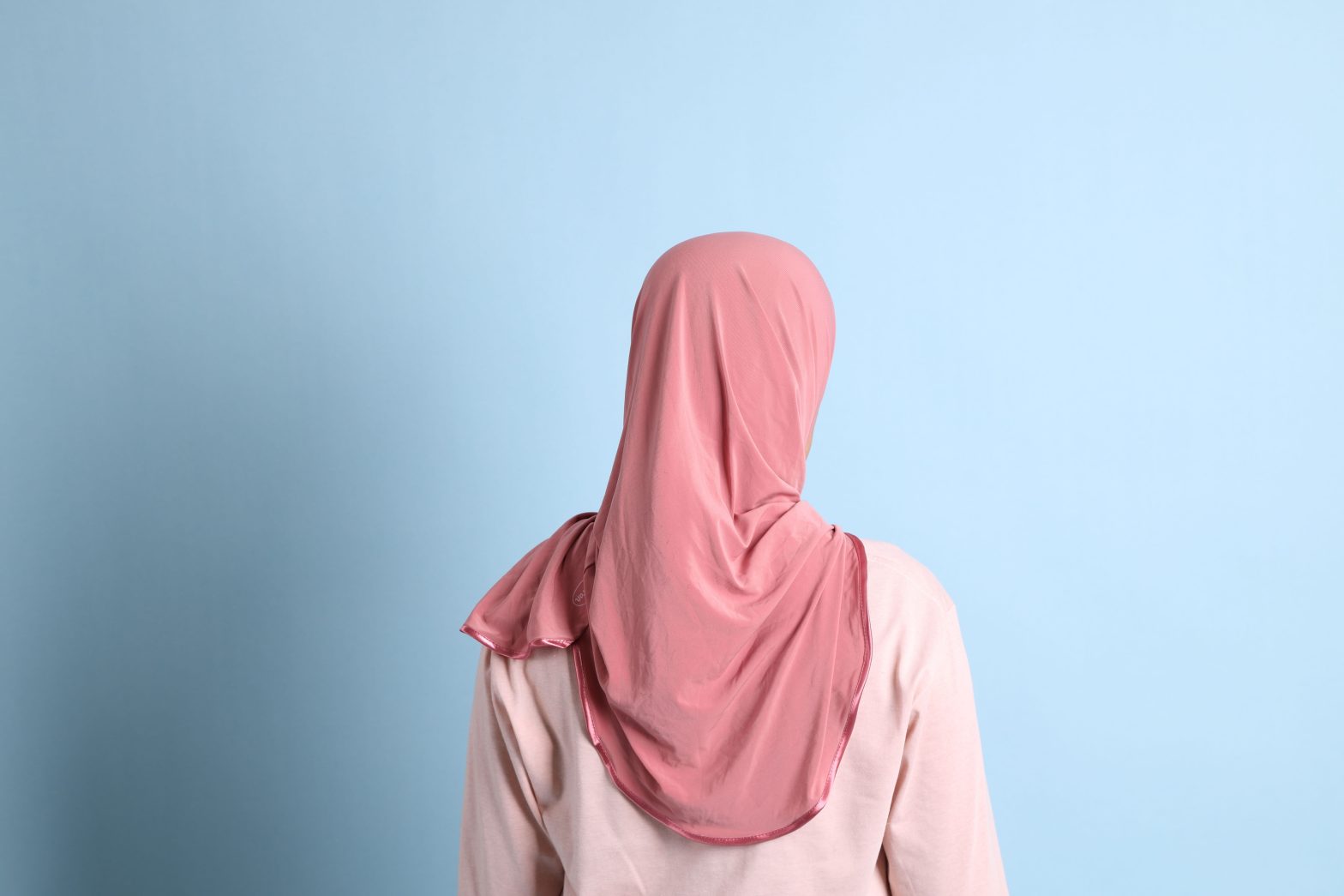 The back of a woman wearing a hijab. Mews - Jannah Hague sued Kent County over forced removal of hijab